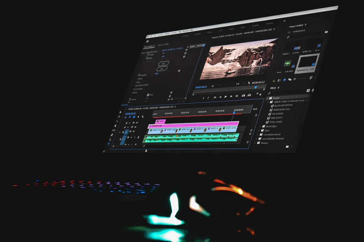 A computer screen with video editing software open, showing a timeline with several layers of picture and sound